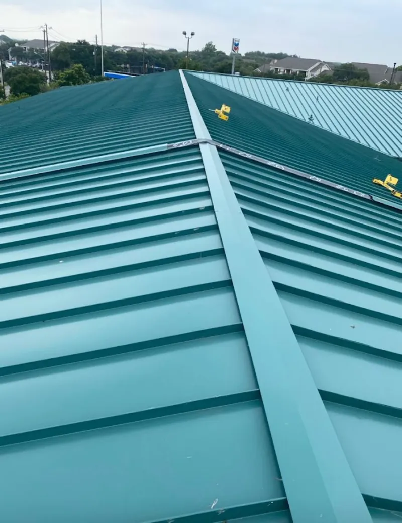 Green commercial metal roof ridge and valley for Metal Roof Repair in Willoughby